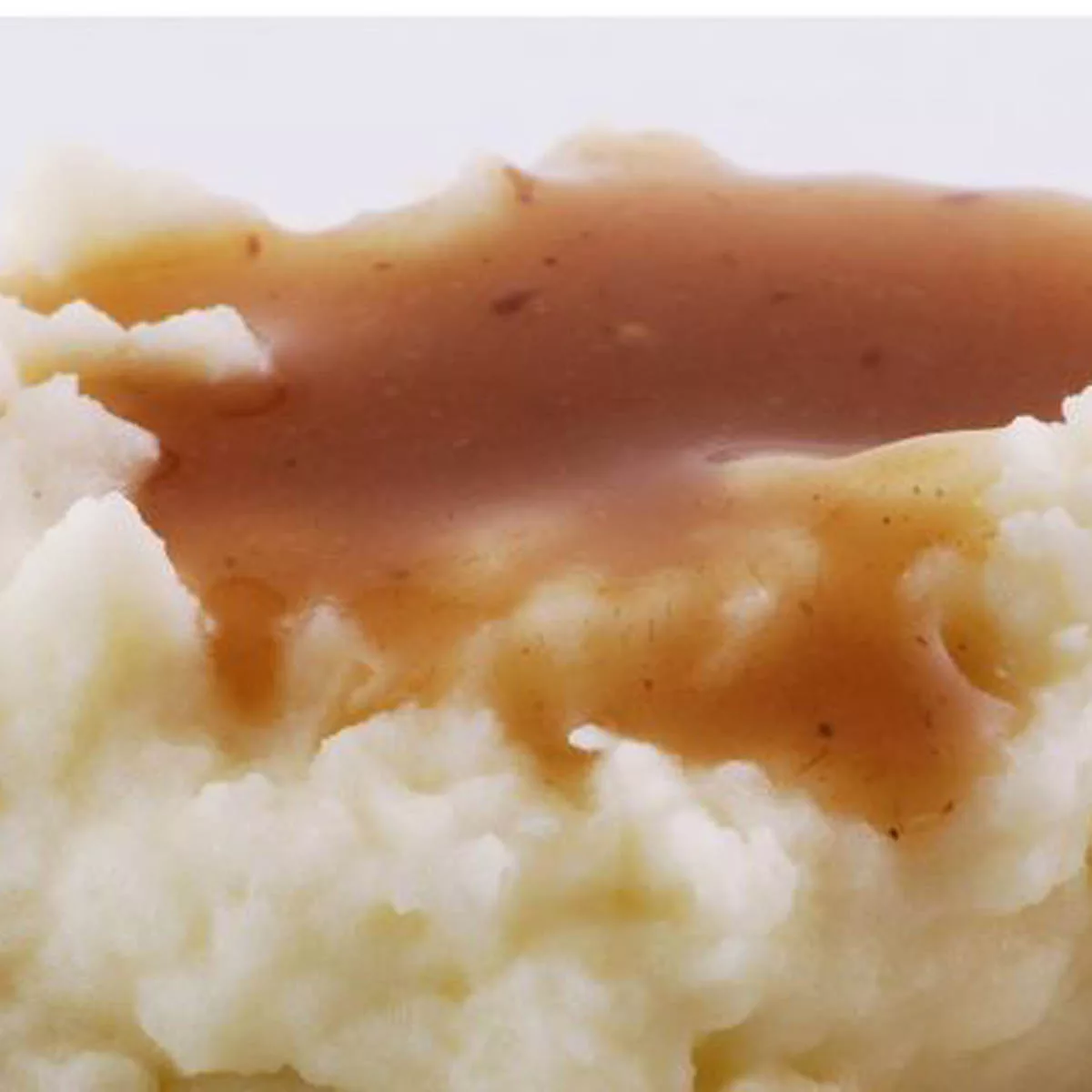 Make-Ahead Gravy on top of some mashed potatoes