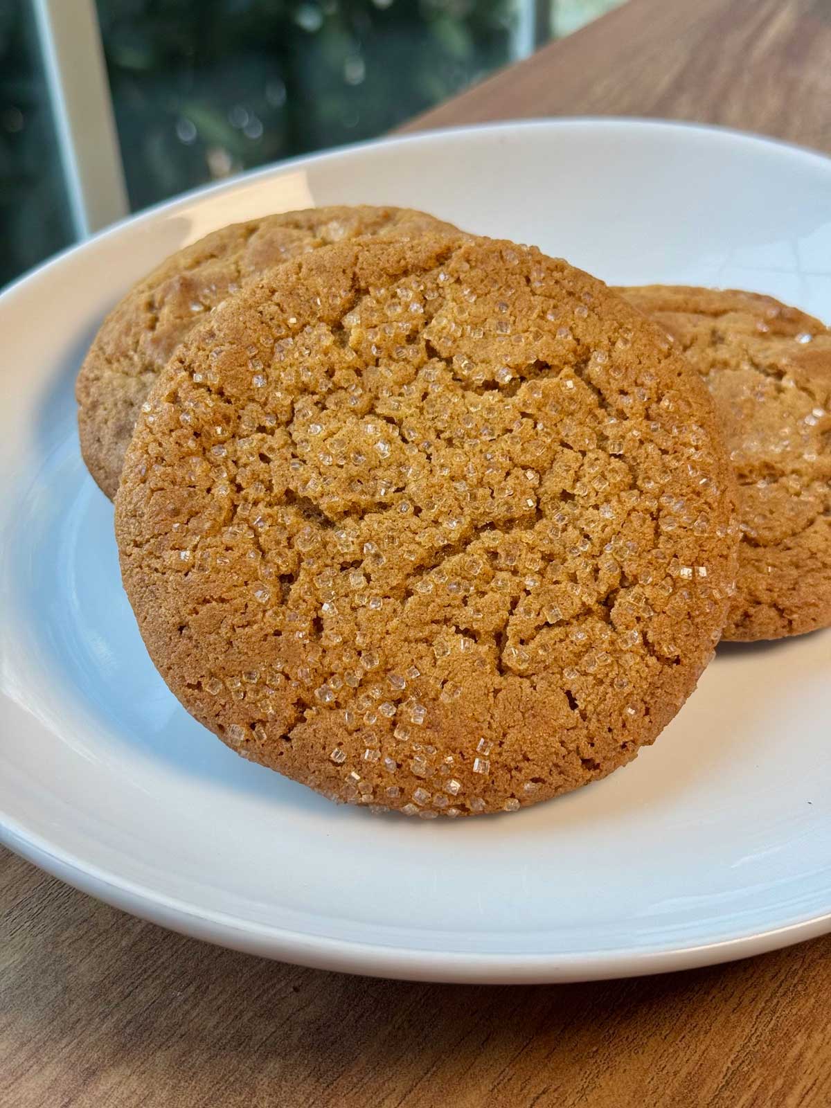 Big chewy molasses cookies with crinkles and sparkling sugar.