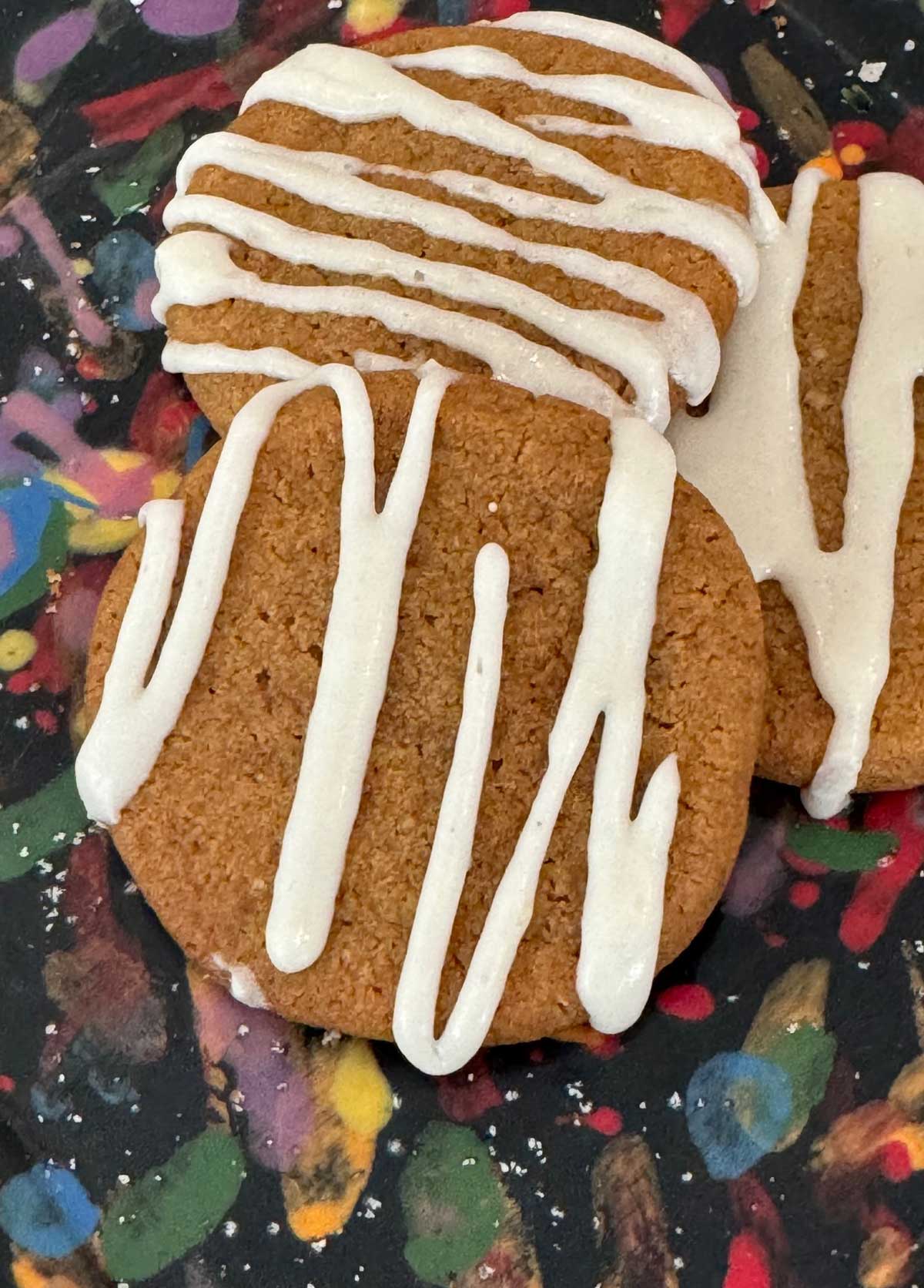 Molasses cookies with a frosting that sets up opaque.