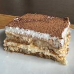 Slice of tiramisu from an 8-inch pan recipe.