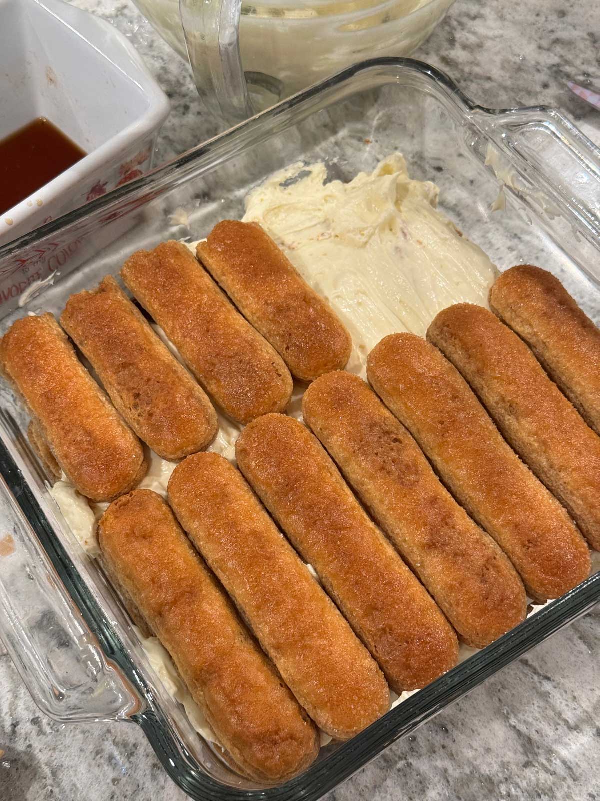 Tiramisu layering technique for 8-inch pan.