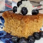 Slice of Upside Down Coconut Cake from The Cake Book recipe