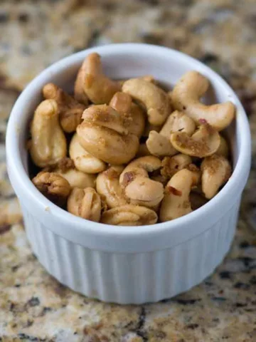 A cup of spiced cashews