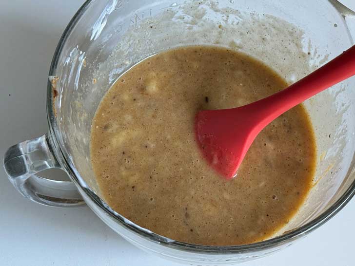 Mixing wet ingredients for Claire Saffitz Almond Butter Banana Bread