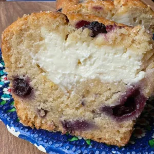 Picture of a blueberry bread with cream cheese filling.