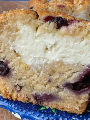 Picture of a blueberry bread with cream cheese filling.