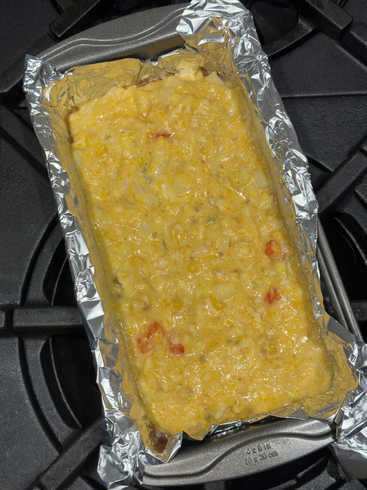 Betty Ewing's Flourless Mexican Cornbread batter baked in a loaf pan.