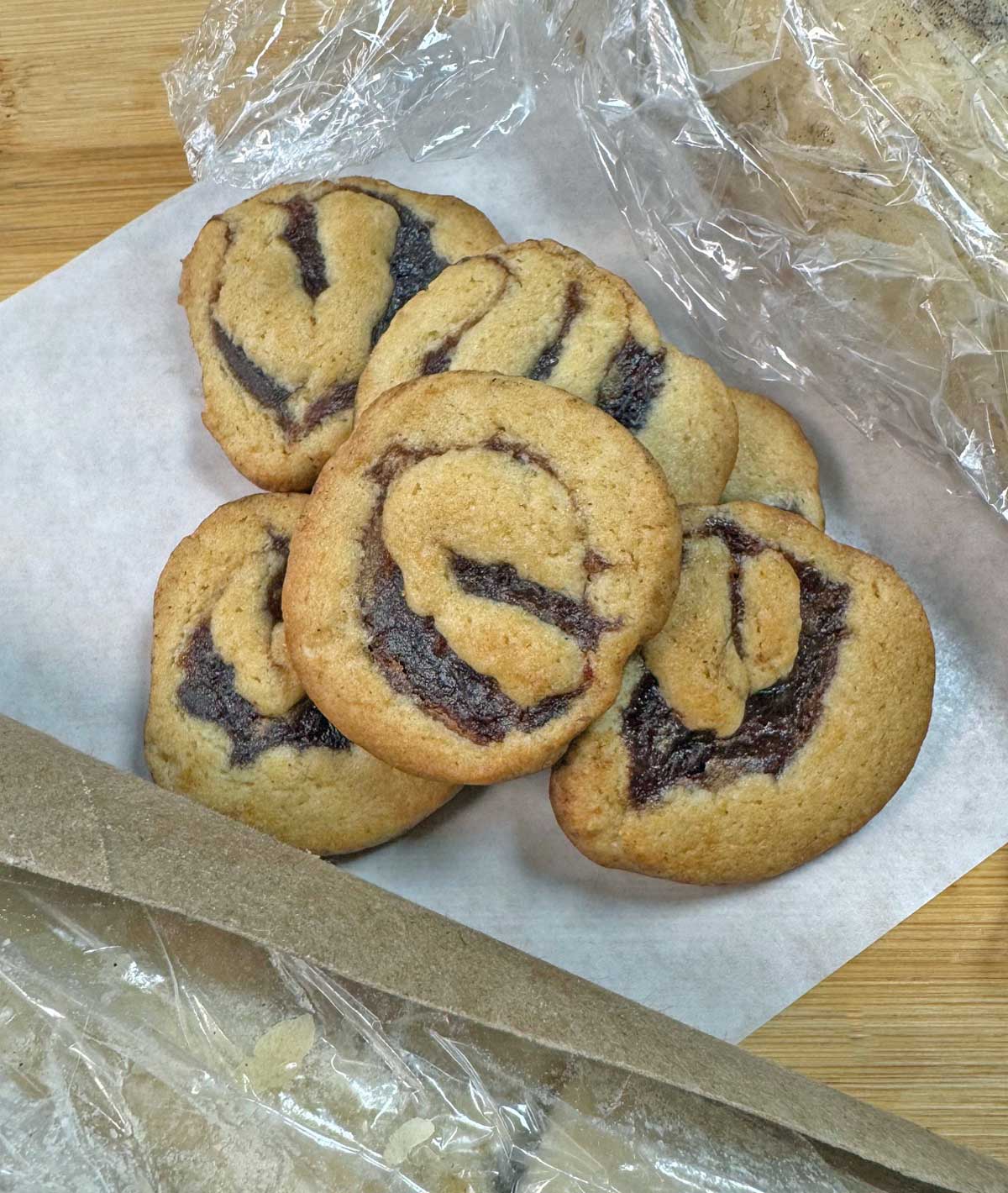 Date Pinwheel cookies cut from a roll with a cardboard paper towel tube.