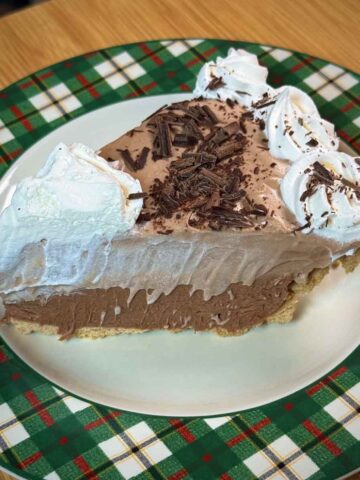 Slice of pie showing layers of bittersweet whipped cream and milk chocolate whipped cream.