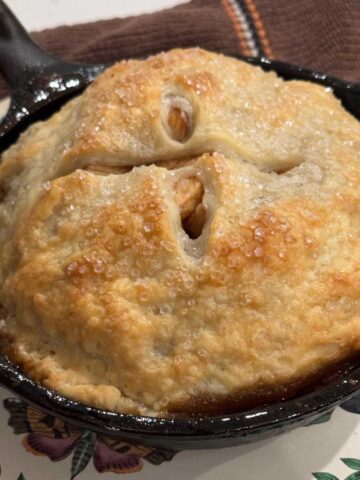 6-inch skillet apple pie in cast iron, still hot and bubbly.