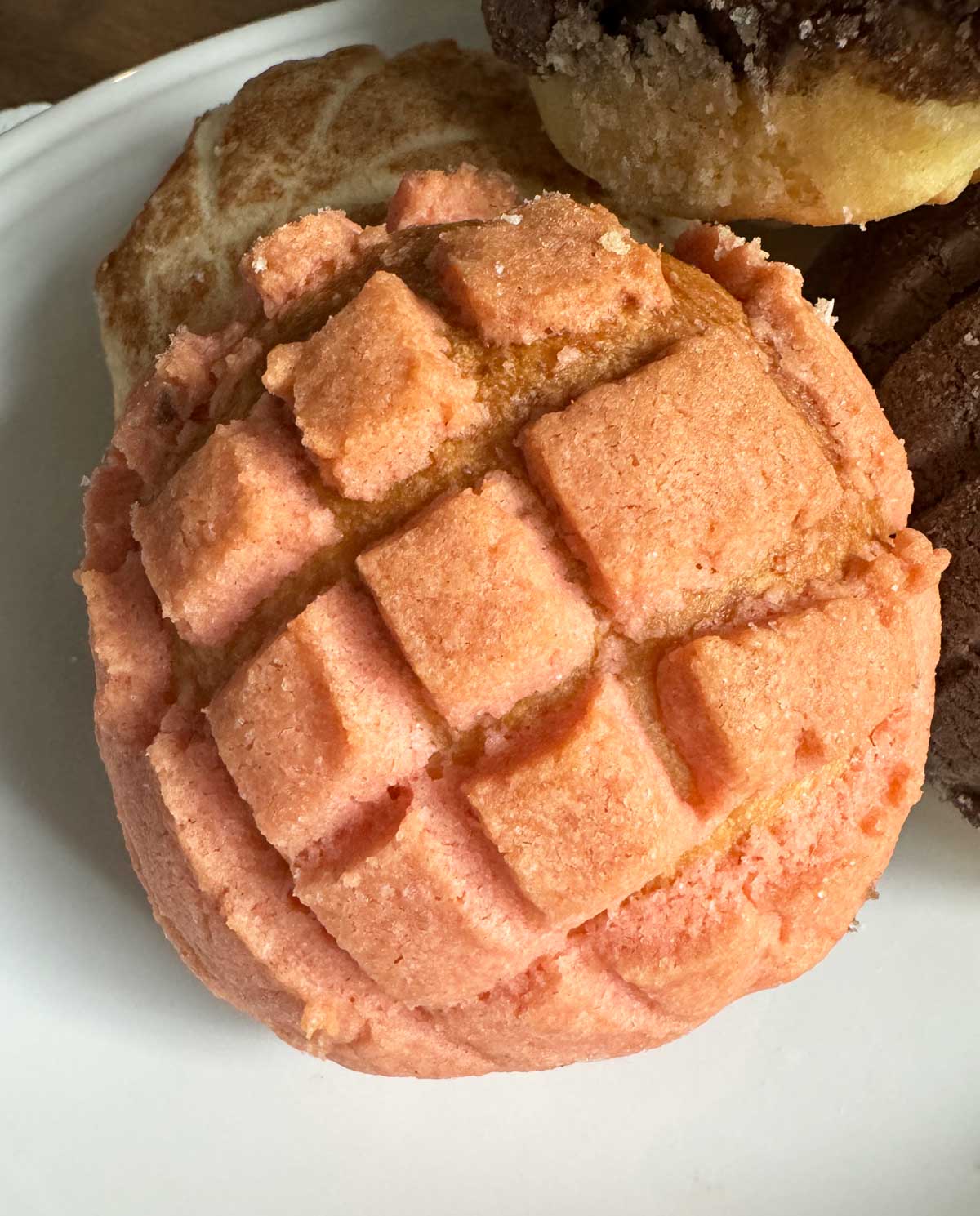 Homemade Conchas recipe with a pink colored cookie topping.