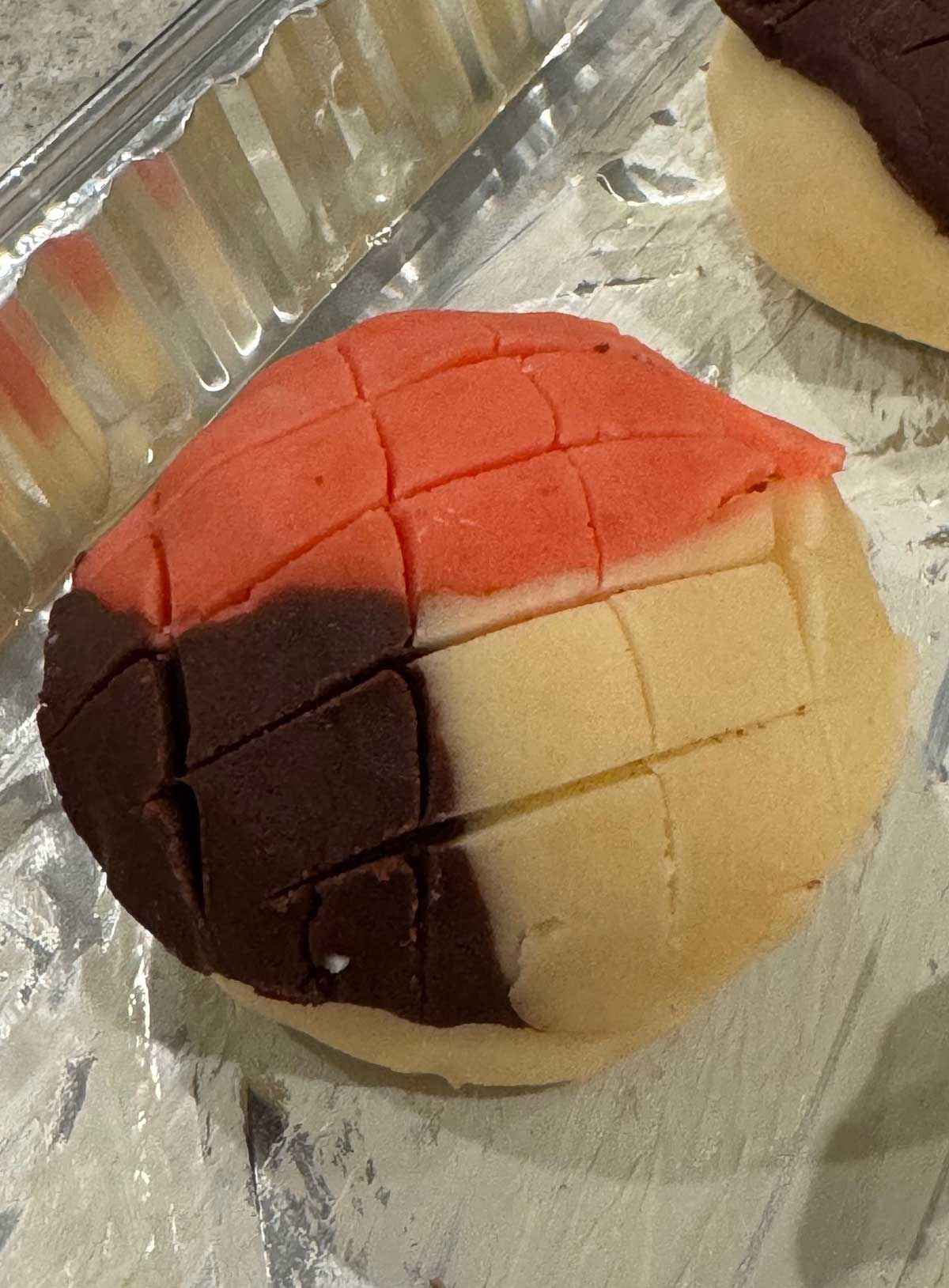 Neapolitan looking dough cut with a razor before being baked.