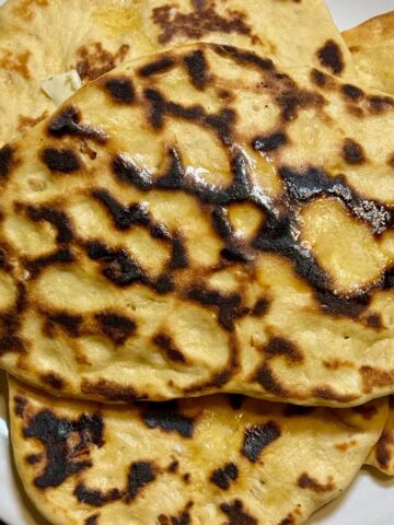 Sweet Potato Naan is just regular naan with mashed sweet potatoes in the dough.