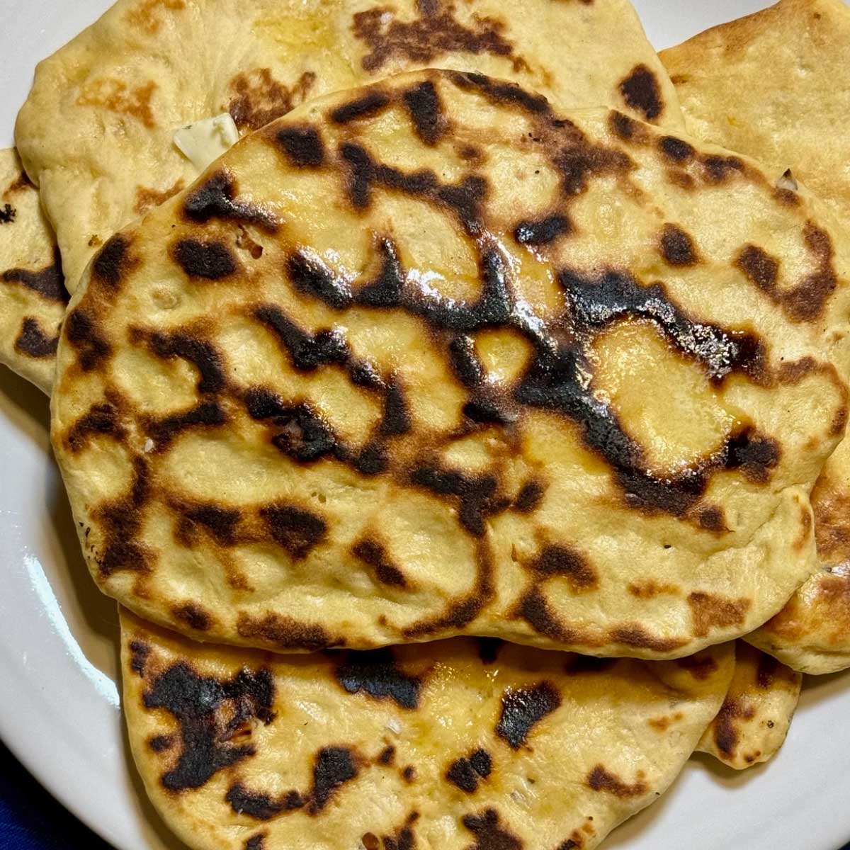 Sweet Potato Naan is just regular naan with mashed sweet potatoes in the dough.