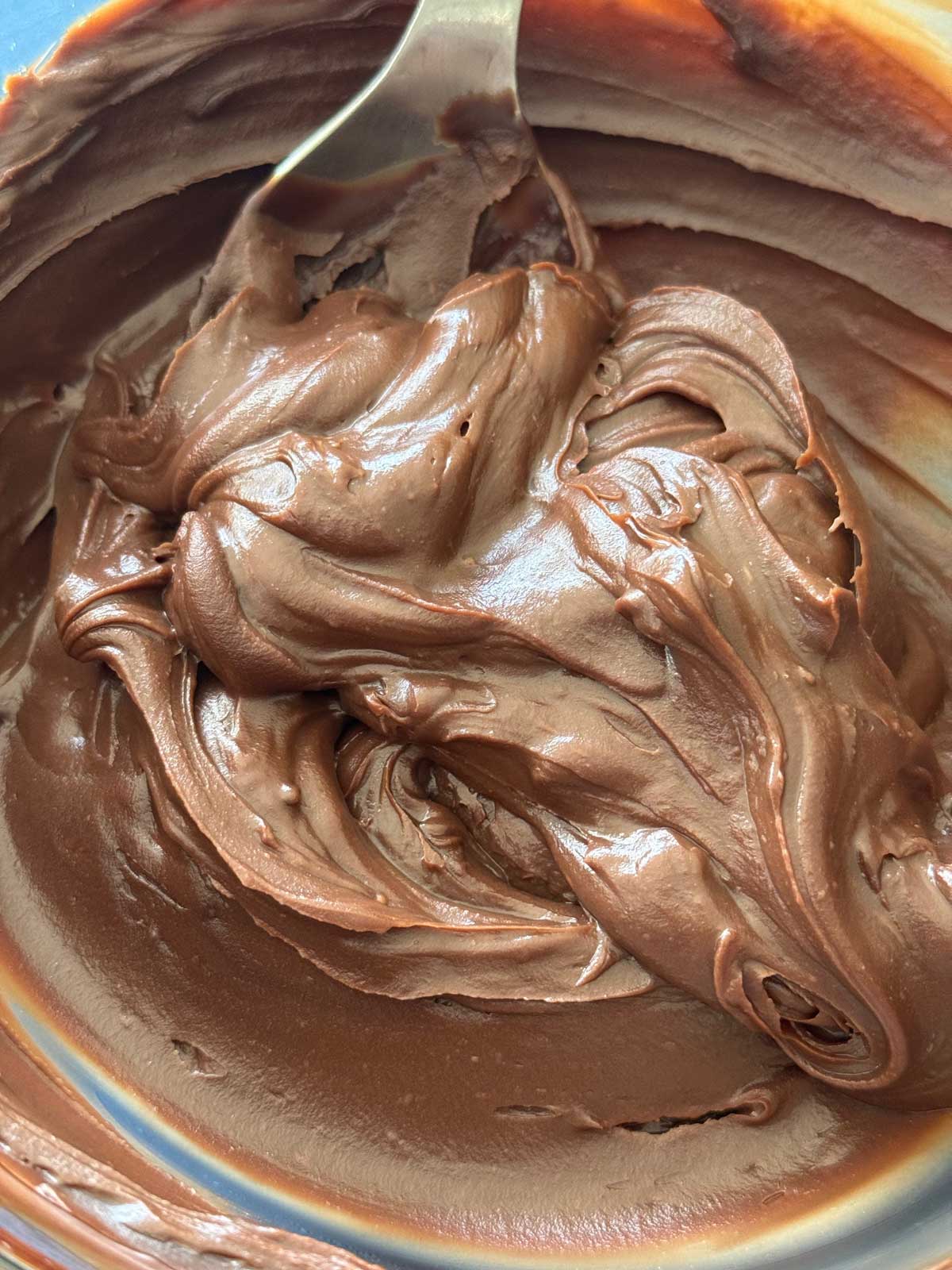 Smooth and creamy chocolate ganache frosting made with sour cream, corn syrup and butter.