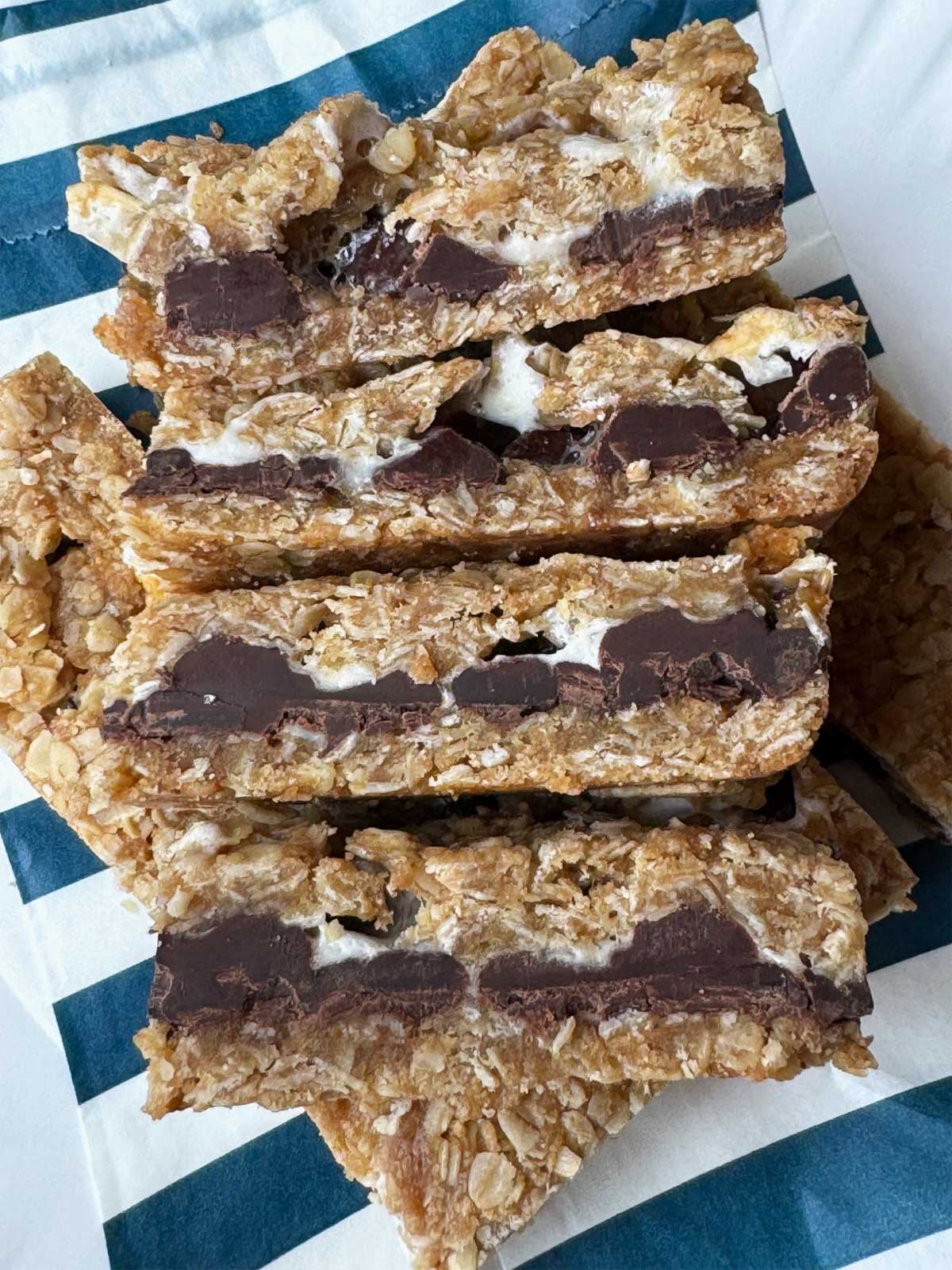 Stack of S'mores Granola Bars from an easy recipe with a side view showing marshmallows and chocolate.