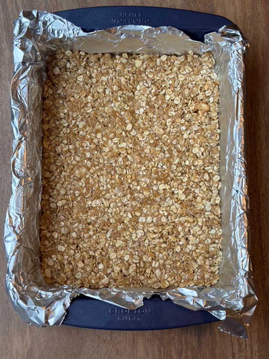 Step 1, pressing oat mixture into bottom of pan.